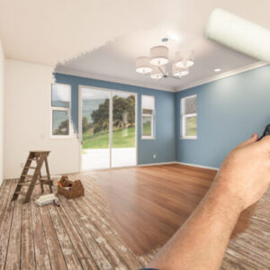 Before and After of Man Painting Roller to Reveal Newly Remodeled Room with Fresh Blue Paint and New Floors.